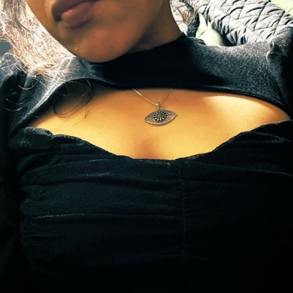 Evil eye pendant on silver necklace